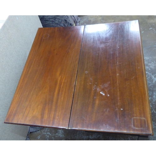 253 - A Regency mahogany foldover card table, raised on square legs  29