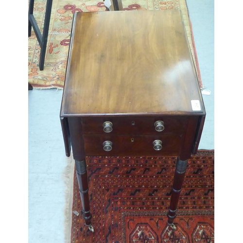 284 - An early 19thC mahogany Pembroke worktable with two lockable end drawers and facsimiles on the rever... 