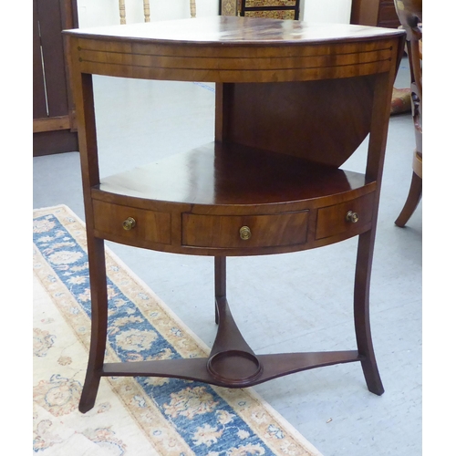 287 - An early 19thC mahogany and ebony string inlaid, freestanding, quadrant washstand, the rising, quart... 