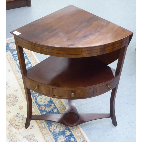 287 - An early 19thC mahogany and ebony string inlaid, freestanding, quadrant washstand, the rising, quart... 