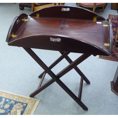 289 - An early 20thC mahogany butler's tray with cut-out handles to the four folding flaps  30