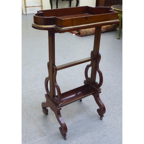 293 - A 19thC mahogany tray top table with a 'broken' gallery, raised on reed carved uprights and fretwork... 