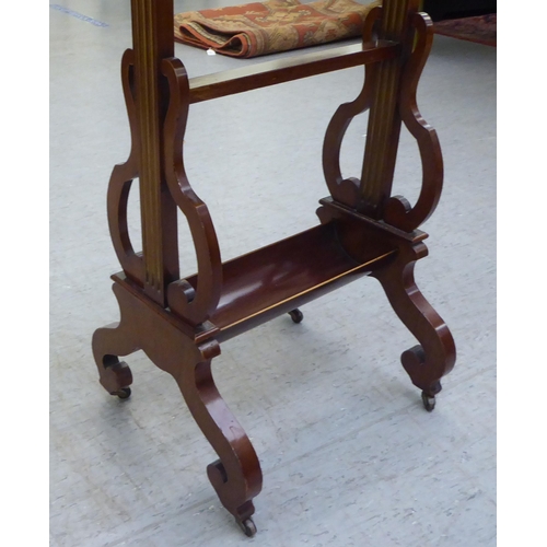 293 - A 19thC mahogany tray top table with a 'broken' gallery, raised on reed carved uprights and fretwork... 