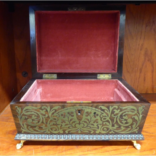 298 - A William IV rosewood casket with inlaid brass ornament and bead carved borders, the hinged lid encl... 