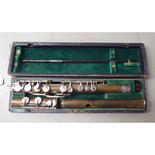 3 - A flute, in a fitted fabric lined carrying case 