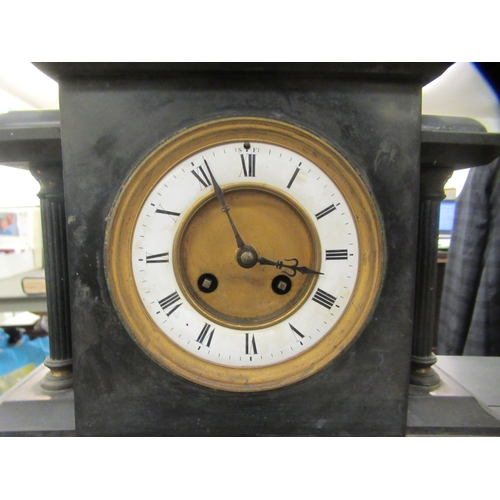 310 - An Edwardian black slate cased mantel clock, faced by a Roman dial  16