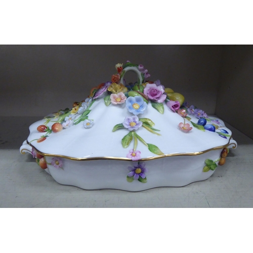 311 - A Herend First Edition porcelain covered dish of serpentine outline, painted and encrusted with flor... 