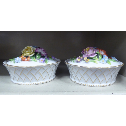 316 - A pair of Dresden porcelain covered basket dishes, decorated with encrusted flora and gilding  ... 