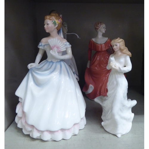 33 - Four porcelain figures: to include Royal Doulton 'Claire'  HN3646  8.5