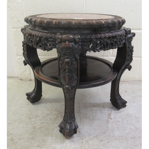 330 - A late 19thC Chinese, profusely carved rosewood side table with an inset, rust coloured marble surfa... 