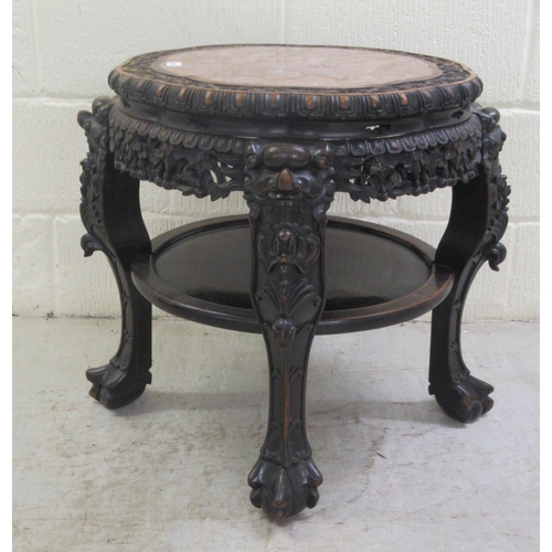 330 - A late 19thC Chinese, profusely carved rosewood side table with an inset, rust coloured marble surfa... 