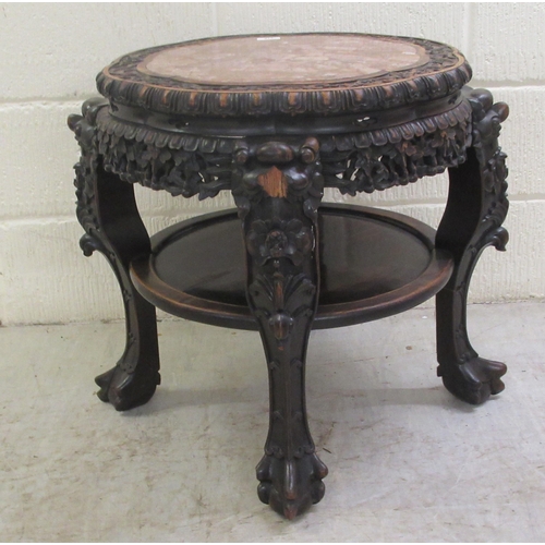 330 - A late 19thC Chinese, profusely carved rosewood side table with an inset, rust coloured marble surfa... 