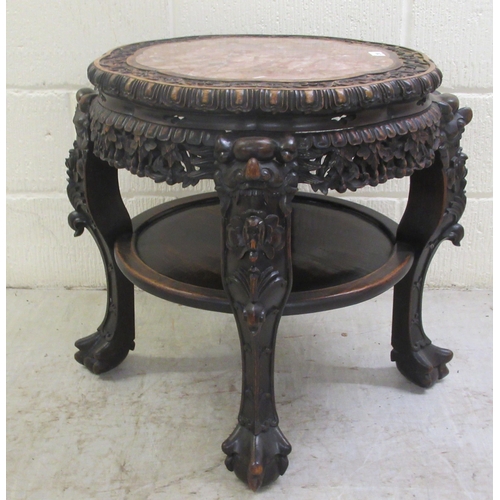 330 - A late 19thC Chinese, profusely carved rosewood side table with an inset, rust coloured marble surfa... 