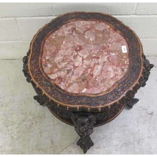 330 - A late 19thC Chinese, profusely carved rosewood side table with an inset, rust coloured marble surfa... 