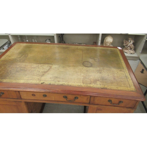 340 - A mid Victorian mahogany, twin pedestal desk, the top set with a tooled and gilded green hide scribe... 