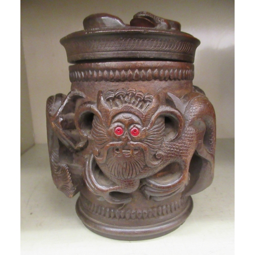 343 - An Oriental carved wooden tobacco jar and cover, decorated with dragons  7