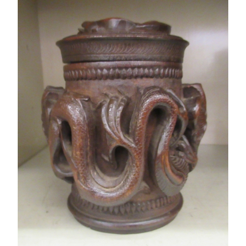 343 - An Oriental carved wooden tobacco jar and cover, decorated with dragons  7