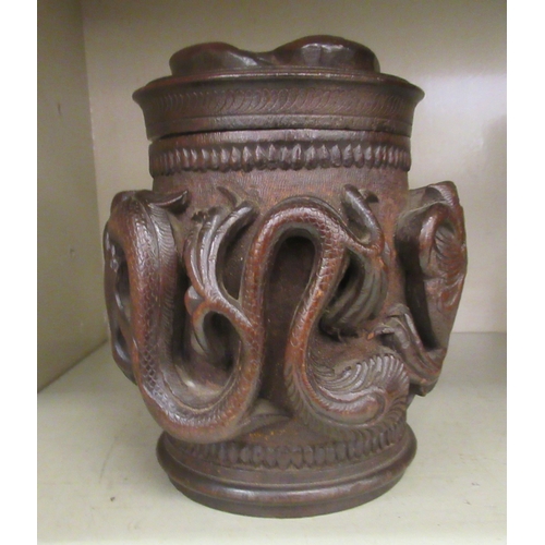 343 - An Oriental carved wooden tobacco jar and cover, decorated with dragons  7