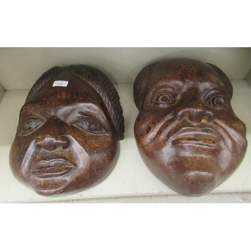 352 - Two similar carved African hardwood masks  18