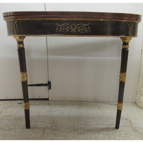 363 - An early 19thC rosewood and crossbanded satinwood, D-shape card table, the foldover top revealing a ... 