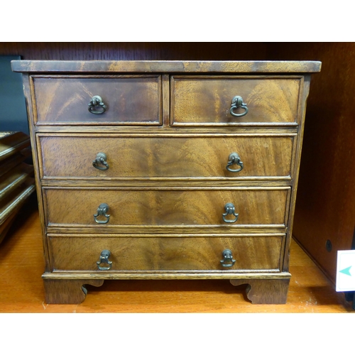 367 - A 20thC miniature, mahogany table top chest of five drawers with drop handles, on bracket feet  9.5