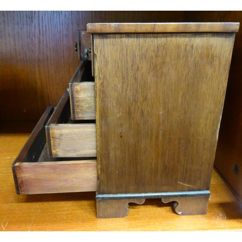 367 - A 20thC miniature, mahogany table top chest of five drawers with drop handles, on bracket feet  9.5