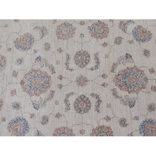 371 - A Persian Mahal rug, decorated with stylised flora and foliage, on a cream coloured ground with a bl... 