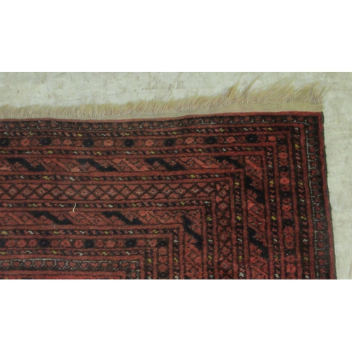 376 - A Bokhara rug, decorated with two columns of nine octagonal guls, on a red ground  41