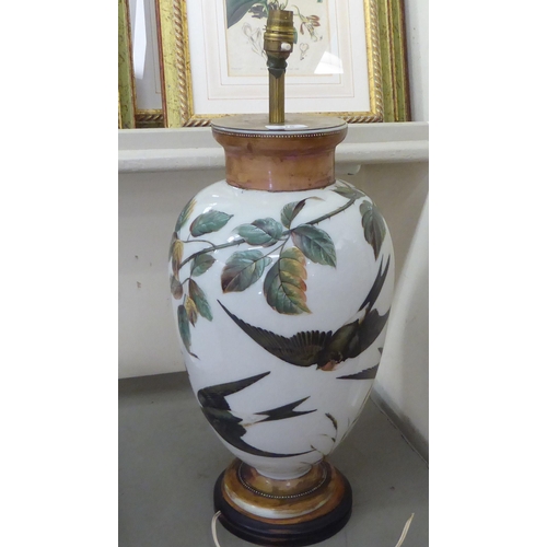 378 - An early 20thC overpainted glass table lamp, decorated with birds in flight  22