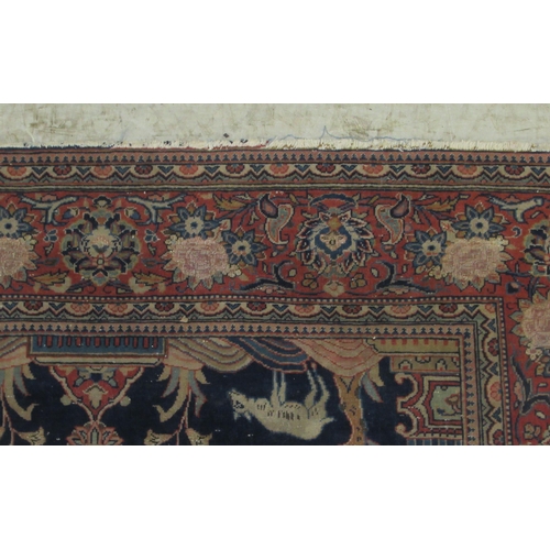 379 - A part silk Kashan rug, decorated with pictorial cartouches, urns, animals, flora and foliage, borde... 