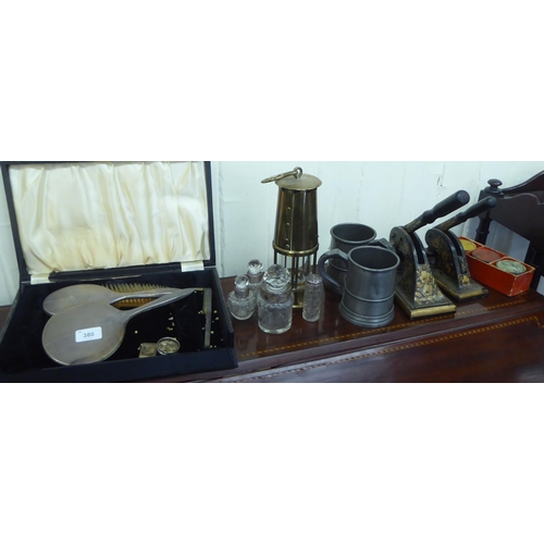 380 - A mixed lot: to include a 1930s three piece silver backed dressing table set  indistinct Birmin... 