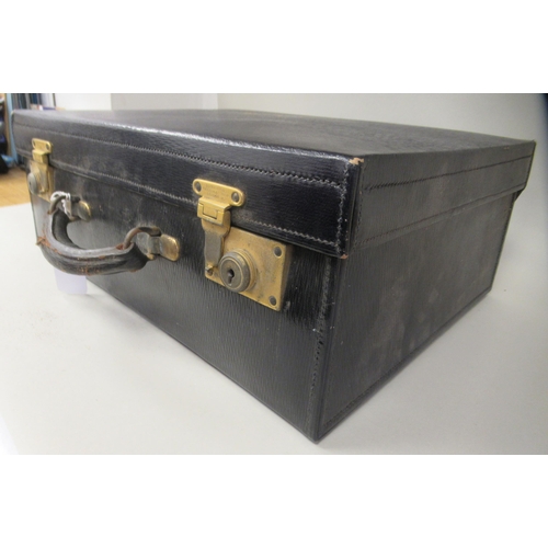 385 - An early 20thC Drew & Sons, Piccadilly Circus, London W, navy blue hide covered vanity case with... 