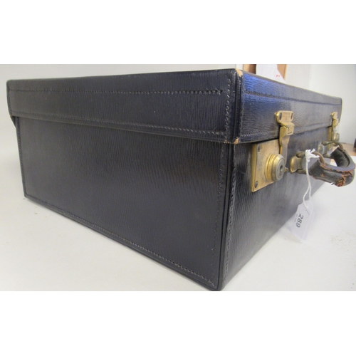 385 - An early 20thC Drew & Sons, Piccadilly Circus, London W, navy blue hide covered vanity case with... 