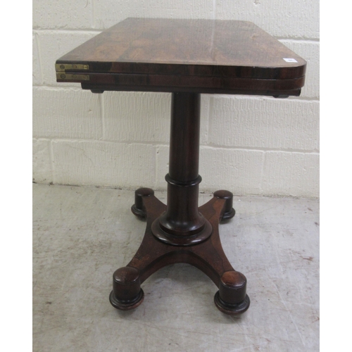 387 - An early 19thC rosewood card table, the rotating foldover top enclosing a green baize lined interior... 