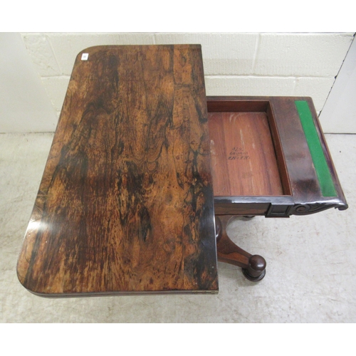 387 - An early 19thC rosewood card table, the rotating foldover top enclosing a green baize lined interior... 