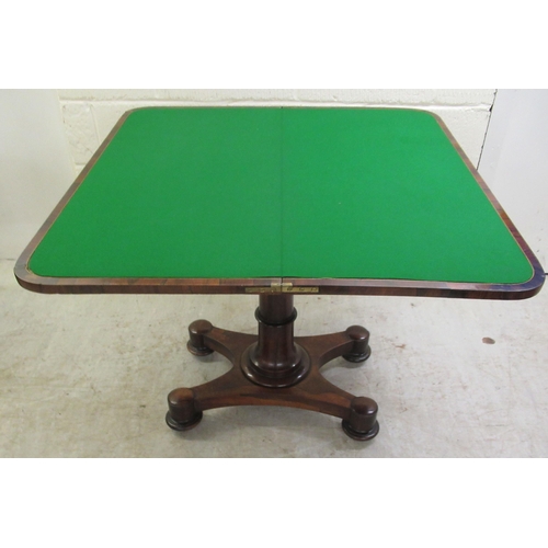 387 - An early 19thC rosewood card table, the rotating foldover top enclosing a green baize lined interior... 