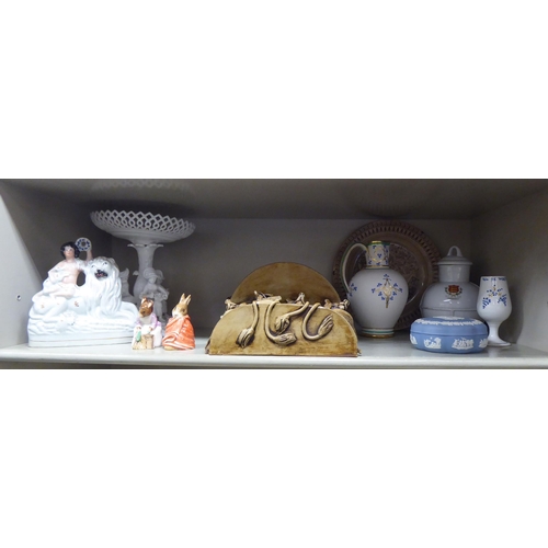 390 - Decorative ceramics: to include a 19thC Staffordshire pottery figure with a lion  7