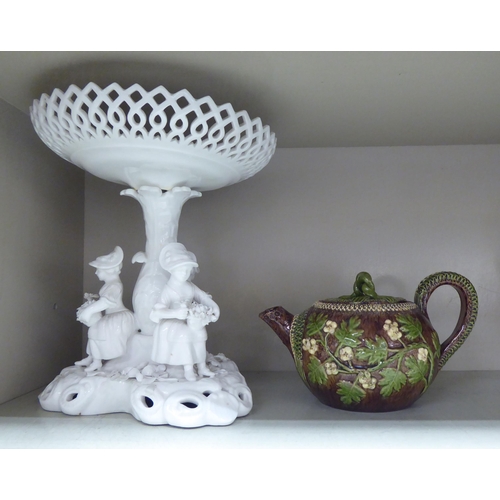 390 - Decorative ceramics: to include a 19thC Staffordshire pottery figure with a lion  7