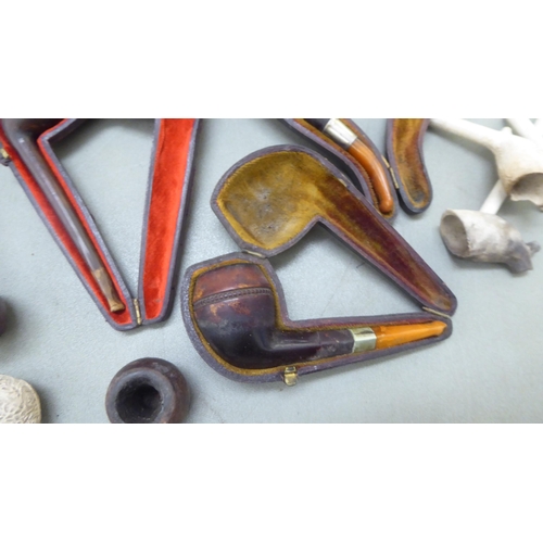 397 - Smoker's pipes: to include a Meersham example with an amber mouthpiece