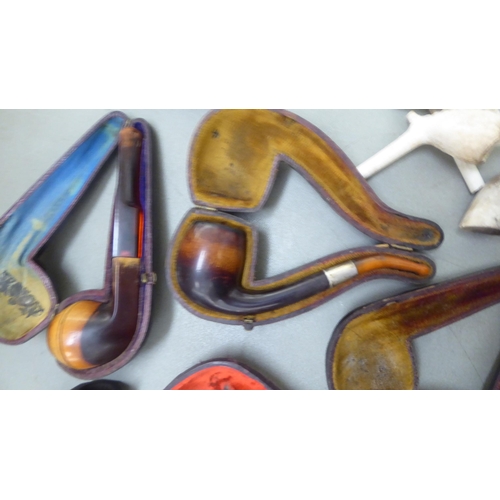 397 - Smoker's pipes: to include a Meersham example with an amber mouthpiece