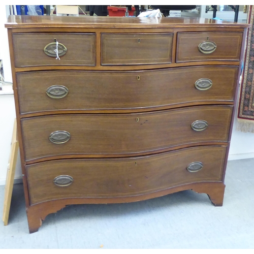 414 - A late 19thc string inlaid mahogany Scottish serpentine front dressing chest with three frieze drawe... 