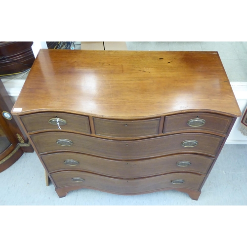 414 - A late 19thc string inlaid mahogany Scottish serpentine front dressing chest with three frieze drawe... 