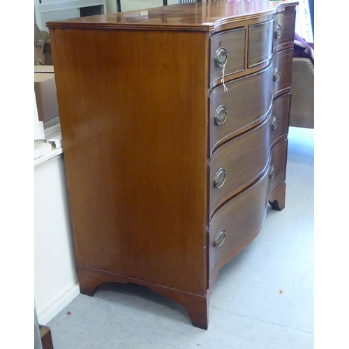 414 - A late 19thc string inlaid mahogany Scottish serpentine front dressing chest with three frieze drawe... 