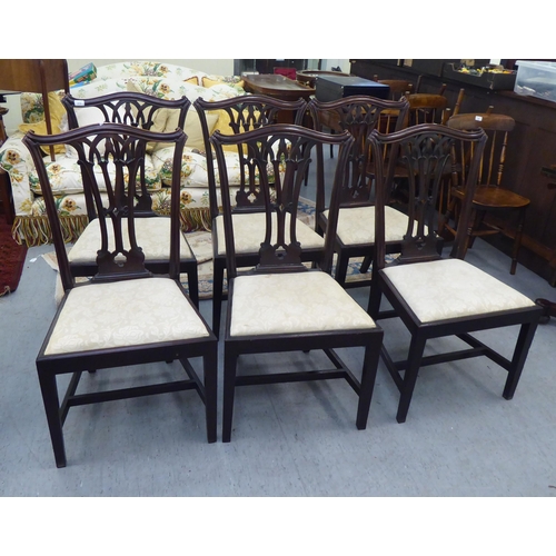 416 - A set of six early 20thC Georgian style chairs, each with an arched back, over a pierced vase design... 