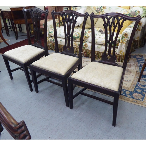 416 - A set of six early 20thC Georgian style chairs, each with an arched back, over a pierced vase design... 