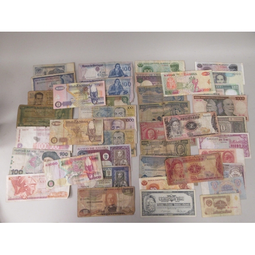 42 - Coins and banknotes: to include Angolan, Portuguese and Brazilian 