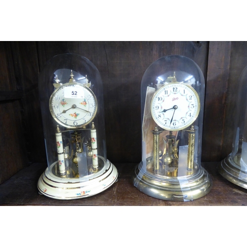 52 - Four 20thC torsion mantel timepieces; variously faced by Arabic and Roman dials, in circular plinths... 