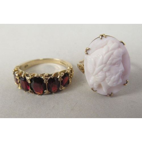 55 - A 9ct gold claw set cameo portrait ring; and a 9ct gold and garnet set dress ring 