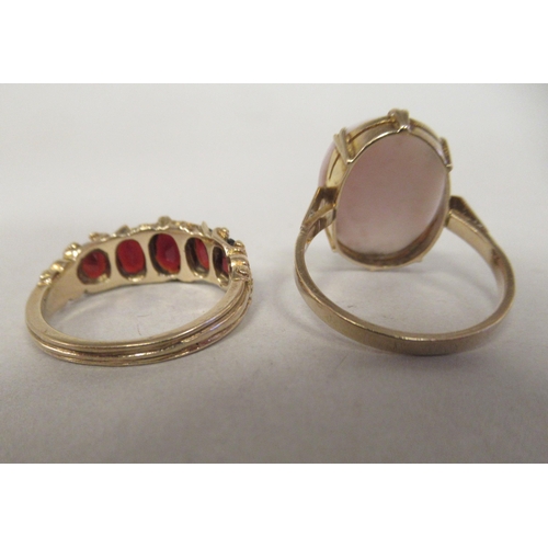 55 - A 9ct gold claw set cameo portrait ring; and a 9ct gold and garnet set dress ring 