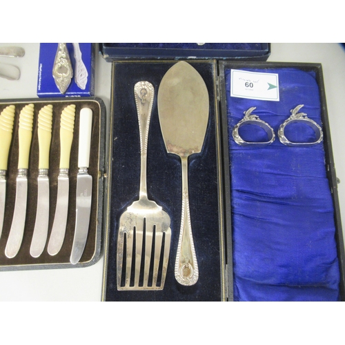 60 - A mixed lot: to include a pair of silver plated sauce ladles and a vintage set of six multi-coloured... 